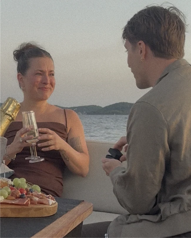 Daniel proposing to Lilly by the water